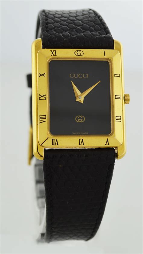 gucci gold tone black dial swiss quartz watch